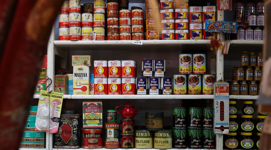 Explore classic canned goods on vintage grocery store shelves, showcasing nostalgic packaging and colors.